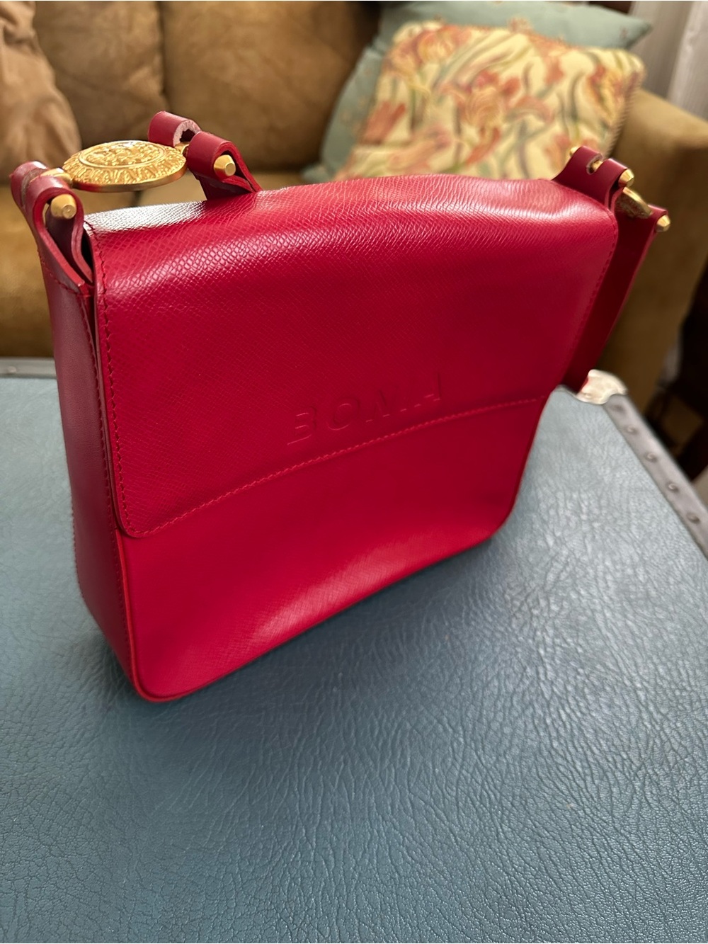 Structured Red Crossbody Bag with Gold Accents